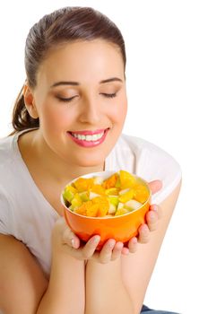 Young woman with fruit salad isolated