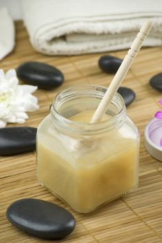 relaxing aroma of almond coconut vanilla milk and honey bath foam over wooden mat