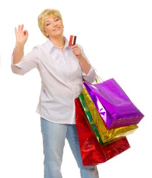 Senior woman with bags and credit card isolated