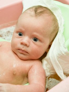 A Swimming baby boy at the bath