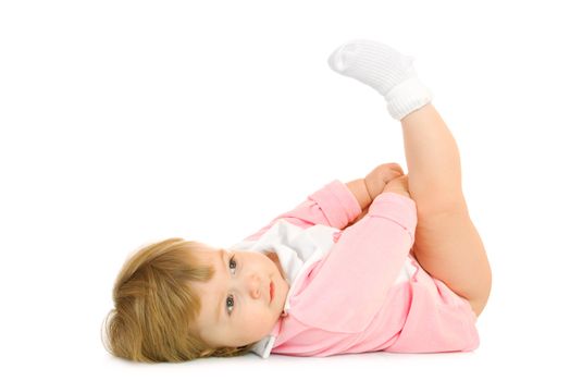 Small baby lay on back and make gymnastic exercise isolated