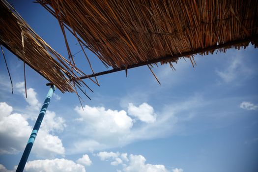 Reed roof outdoors under the summer sky