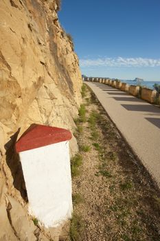 Milestone with copy space next to a scenic road