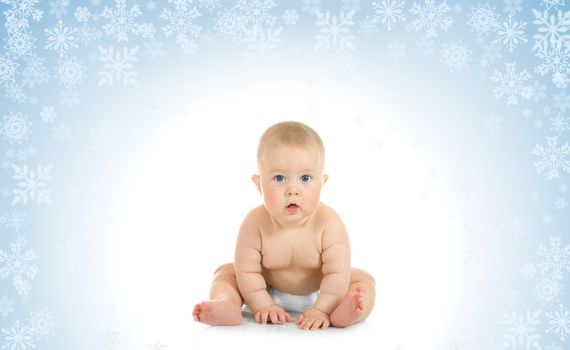 Sitting small baby on blue background with snowflakes