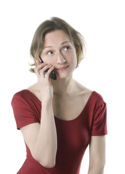 Woman in sport clothes talking on cellphone, studio shot