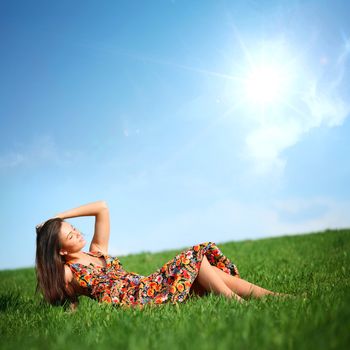 happy woman on green grass 