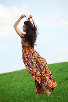 happy woman on green grass 