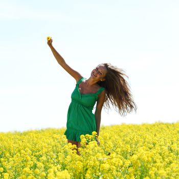 woman on oilseed field close portrait