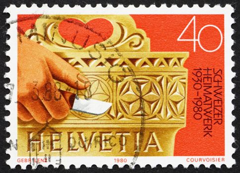 SWITZERLAND - CIRCA 1980: a stamp printed in the Switzerland shows Hand Carved Milk Bucket, Work at Home, circa 1980