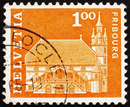 SWITZERLAND - CIRCA 1960: a stamp printed in the Switzerland shows Town hall, Fribourg, Switzerland, circa 1960