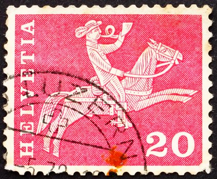 SWITZERLAND - CIRCA 1960: a stamp printed in the Switzerland shows Postilion on Horseback, circa 1960