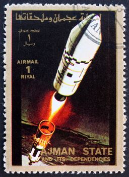 AJMAN - CIRCA 1973: a stamp printed in the Ajman shows Rocket in Space, Spaceflight Program, circa 1973