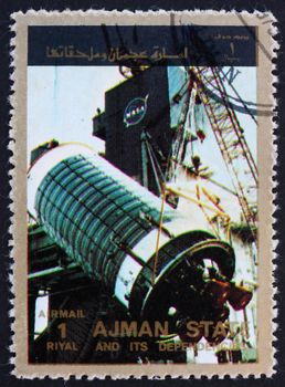 AJMAN - CIRCA 1973: a stamp printed in the Ajman shows Assembly of a Rocket, Space Exploration Program, circa 1973