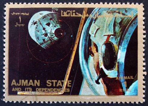 AJMAN - CIRCA 1973: a stamp printed in the Ajman shows Docking Maneuver, Space Exploration Program, Apollo, circa 1973