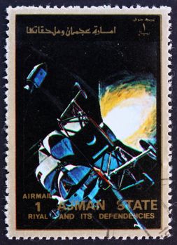 AJMAN - CIRCA 1973: a stamp printed in the Ajman shows Lunar Module and Command Module in Space, Eagle and Columbia, Moon-landing, Apollo 11, circa 1973