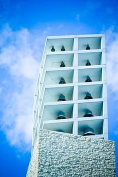 Two bells on the tower against the blue sky