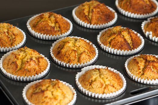 Home baked banana muffins in an oven tray