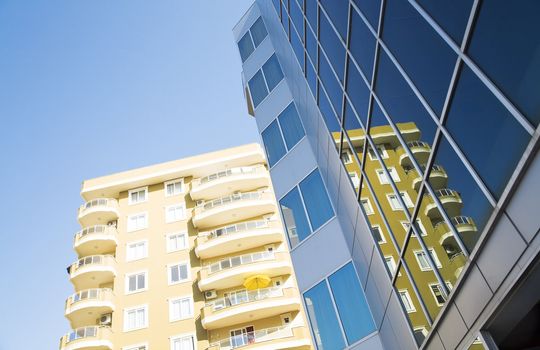 windows and balconies of modern residential buildings