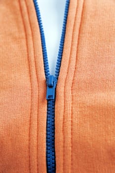 blue zipper on fashionable orange warm wear