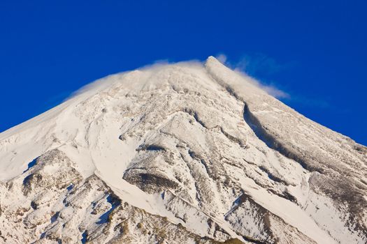 Close-up of the snowy mountain peak of Mt Taranaki or Mt Egmont, New Zealand