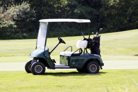 golf car on a course in summer at golf club caddy