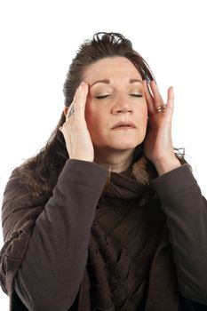 This woman has a stressed out look on her face while holding her hands on her head and temples.
