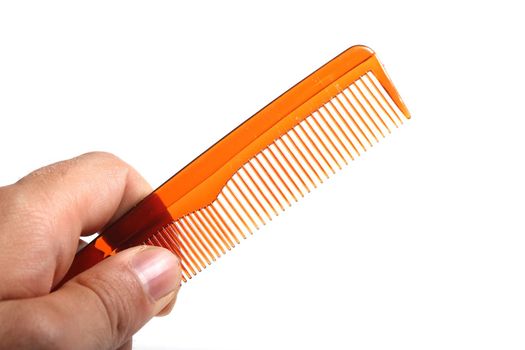 plain plastic comb in a human hand