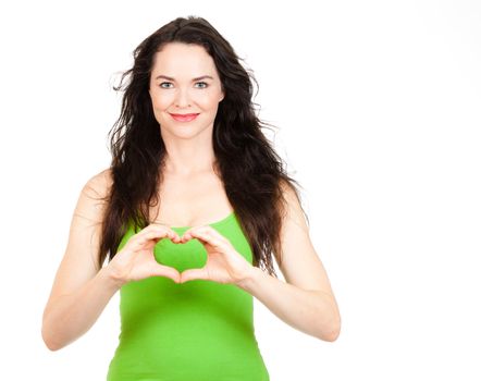 Beautiful young woman symboling a love heart with hands. Isolated over white.