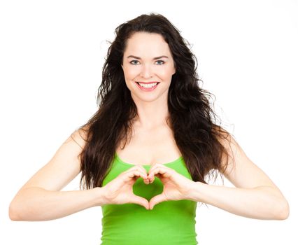 Beautiful young woman making a love heart with hands. Isolated over white.