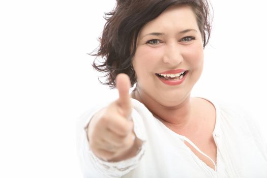 Middle-aged woman shows the cheerful thumbs up - cutout on white