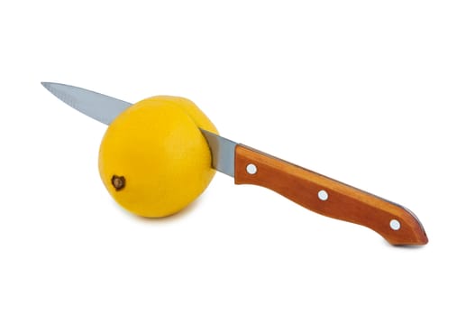 Knife cuts lemon fruit. Objects isolated on white background.