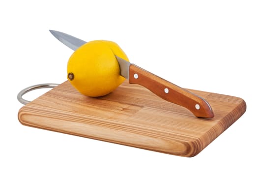 Knife cuts lemon on cutting board objects isolated white background.