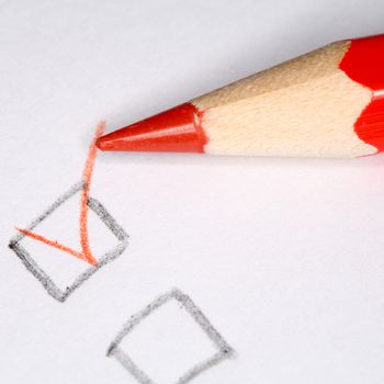 Closeup image of pencil laying on white sheet of paper