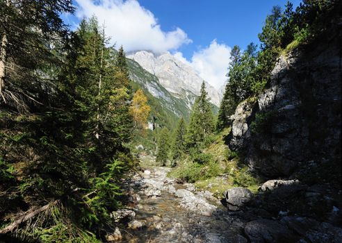 River in mountains in the italian alps