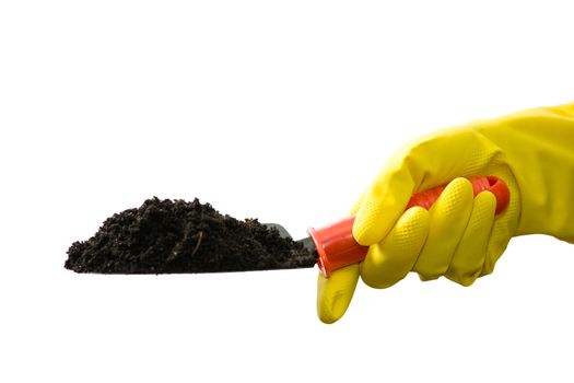 Stock photo: an image of a hand in yellow glove with garden shovel