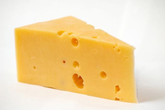 A piece of cheese on a white background
