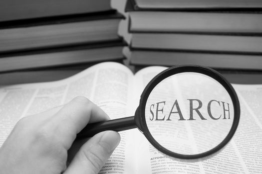 An image of magnifier with lettering "SEARCH"