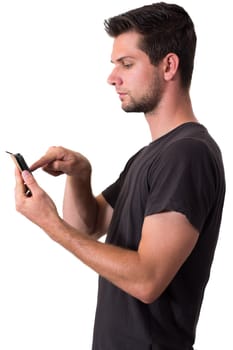 Young White Man In Black T-Shirt Working On His Smartphone
