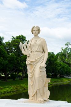 Female  statue made of marble. Decorative gardens of The Bang Pa-in Palace, Ayutthaya, Thailand.