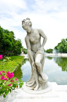 Female nude statue made of marble. Decorative gardens of The Bang Pa-in Palace, Ayutthaya, Thailand.