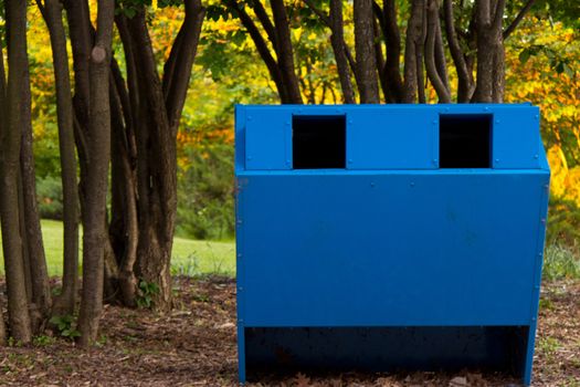 Recycling bin in the park.  Horizontal composition with copy space.