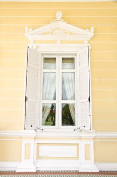 beautifully framed ancient window and wood wall