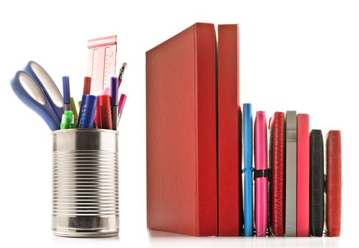 Stationery and books on white background with space for text