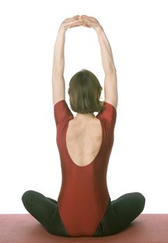 Woman exercising on a mat over white background