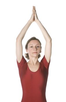 Woman in a red leotard exercising over white background