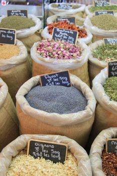 Herbes and spices in jute bags on a Provencal market in France