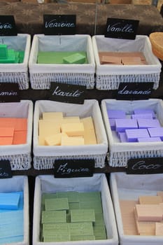 Bars of soap in many different colors on a market in the Provence, France
