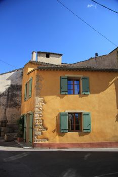 House in the Provence, France. Wooden painted shutters