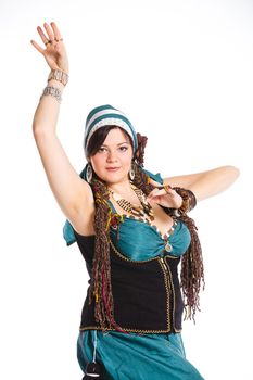Oriental dancer in blue costume over white background