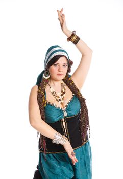 Oriental dancer in blue costume over white background